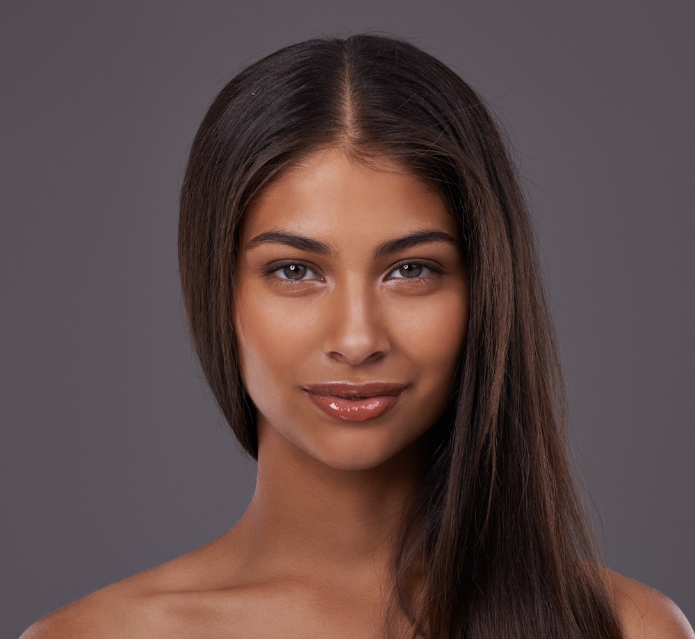 beautiful young woman on dark background